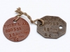 Pair of WW I “dog tags” worn by 880559 Pte. J.A. Sugrue, a barber from Chatham who enlisted with the 186th Kent Overseas Battalion and served in France with the 18th Battalion.