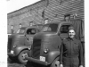 Man in Uniform in front of Truck