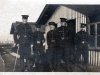 5 Soldiers in Uniform outside Buildings