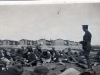 Soldier Standing Among many others Sitting