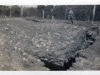 Soldier Walking Near what Appears to be a Trench