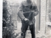 Soldier with Rifle and Helmet in Uniform