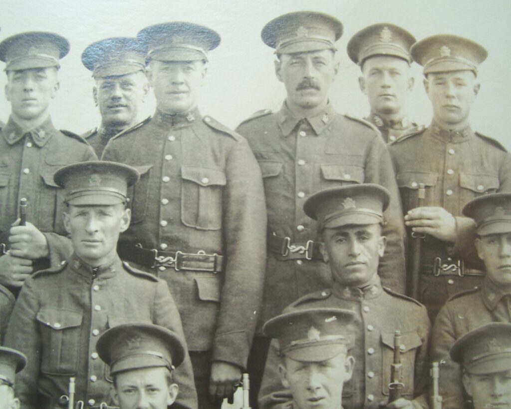 Armand Paquette with Mustache in Back Row